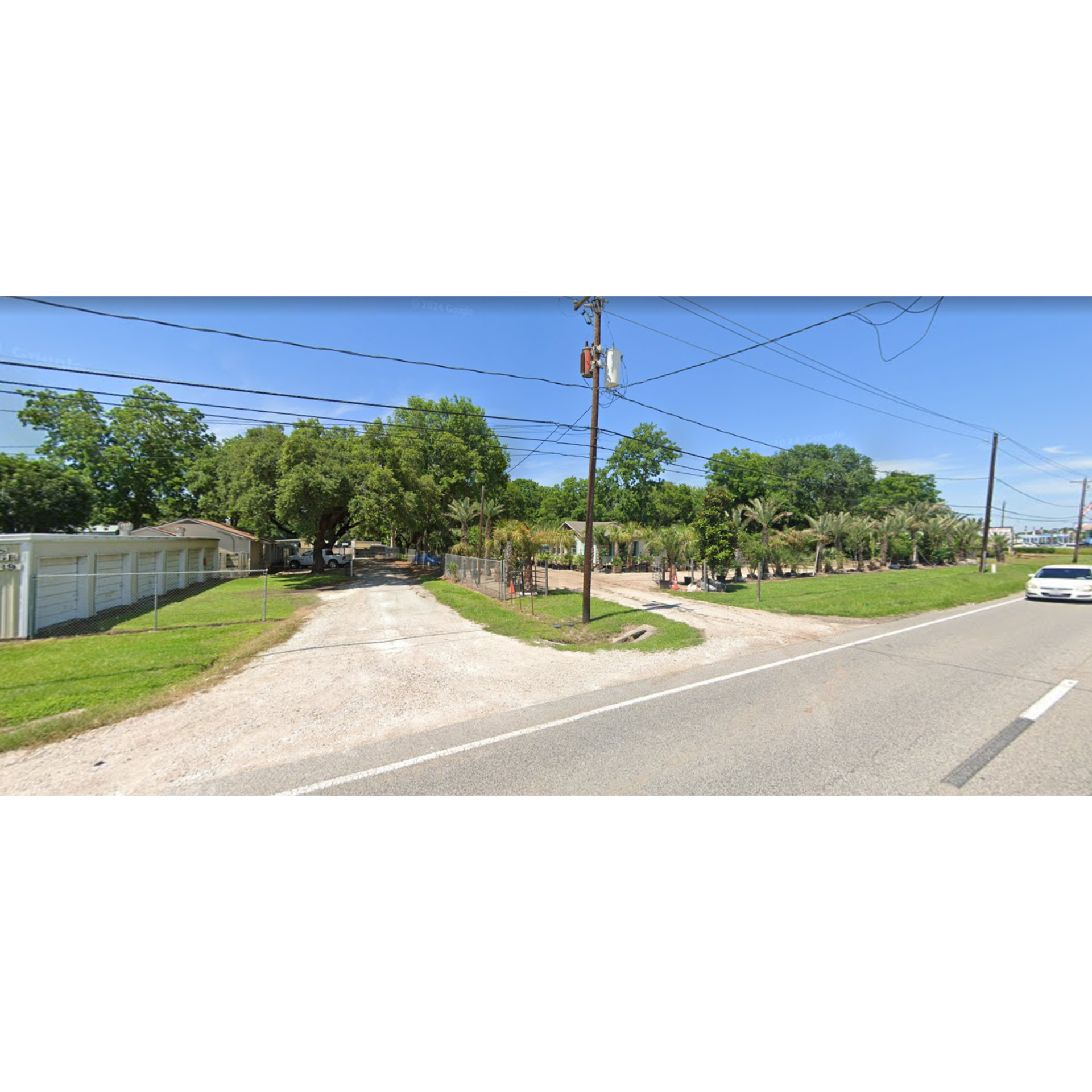 Three blue storage unit doors, numbered 9, 8, and 7, with yellow bollards in front.
