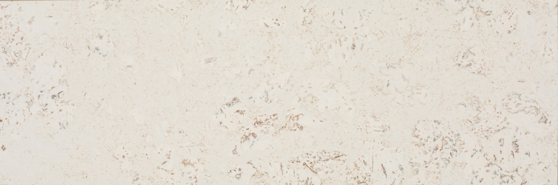 A close up of a white wall with a texture.