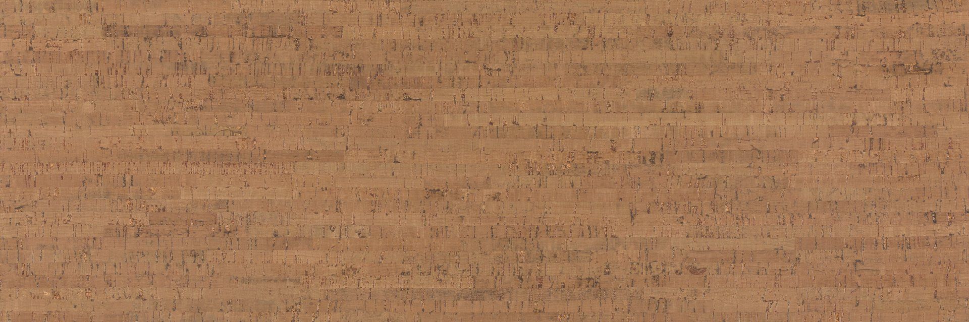 Gros plan d'un morceau de carton à la texture granuleuse.