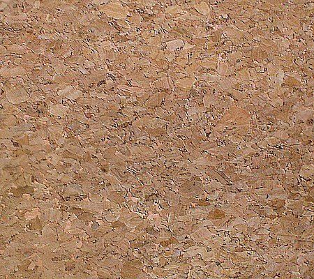 A close up of a cork board showing the texture