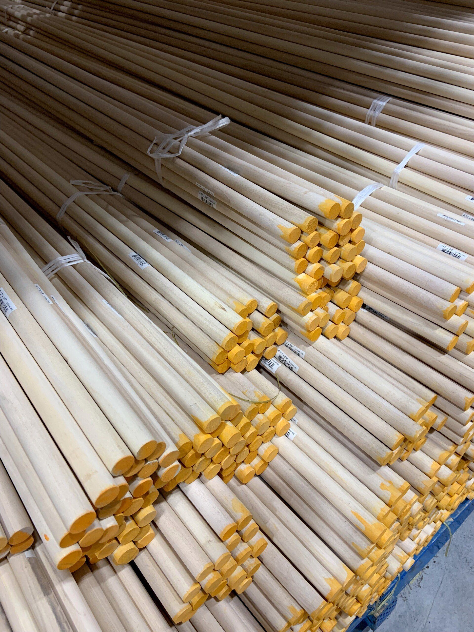 A bunch of wooden sticks are stacked on top of each other