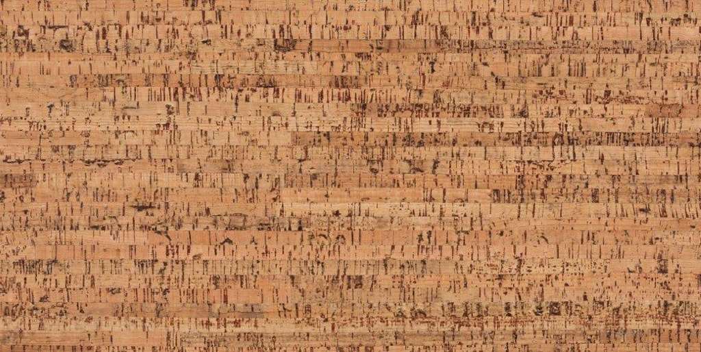 A close up of a piece of cork that looks like a piece of wood.