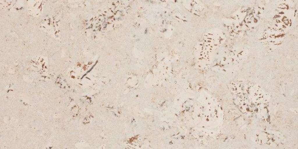 Un gros plan d'une texture de marbre avec quelques petites taches dessus.