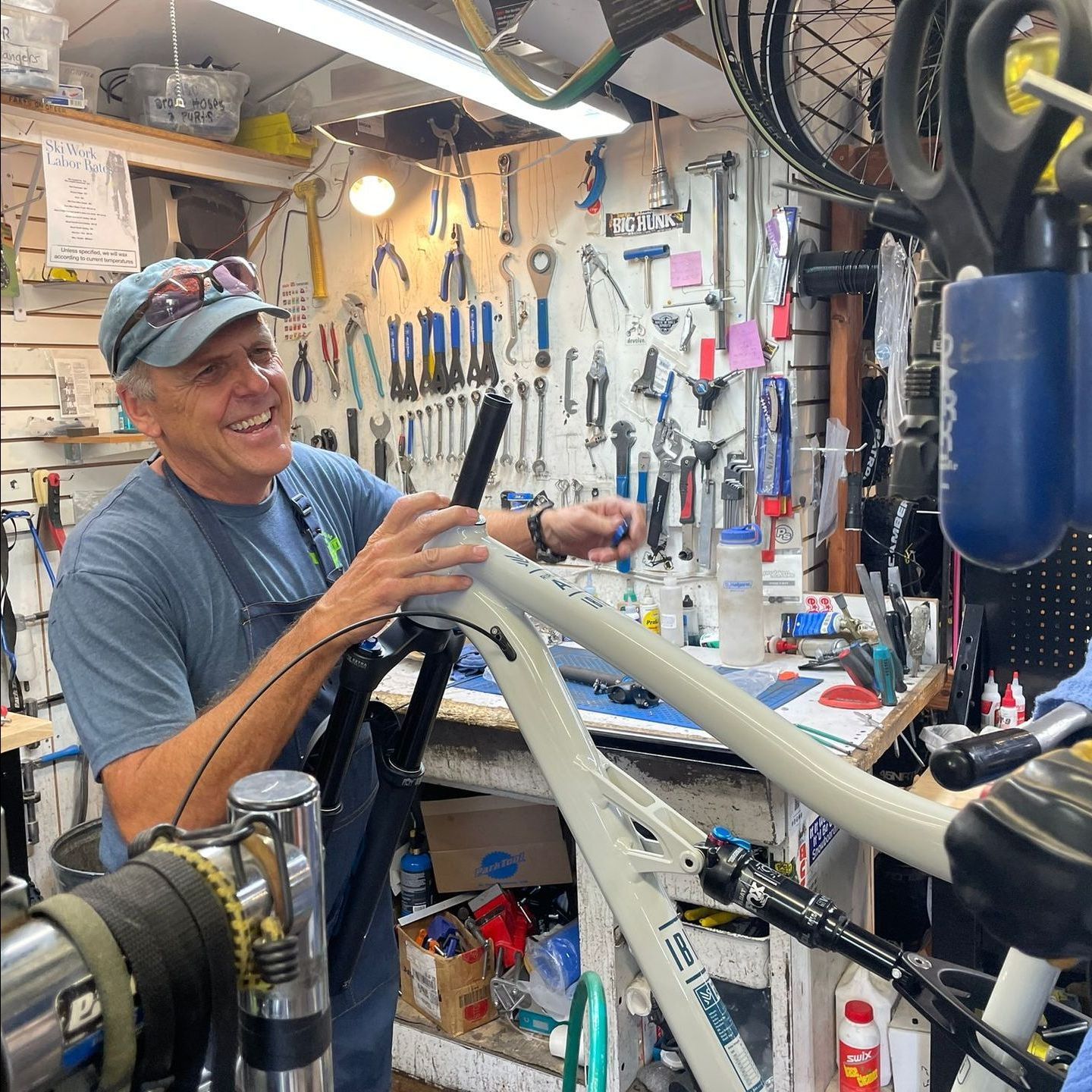 Dave Moe works on a mountain bike in his shop
