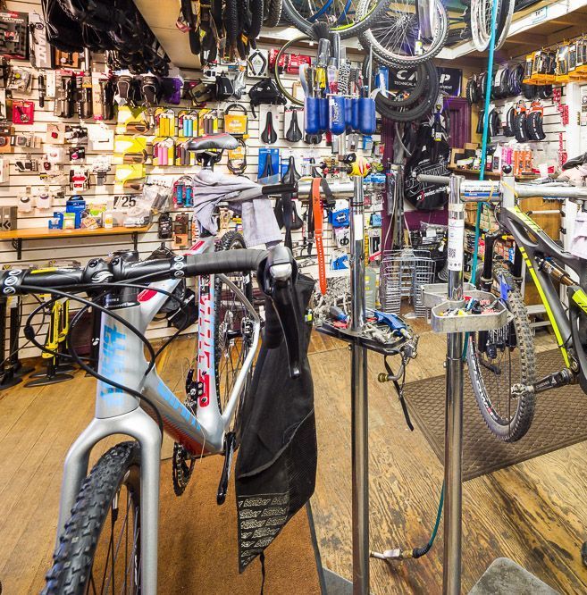 Several bicycles are displayed in a bicycle shop
