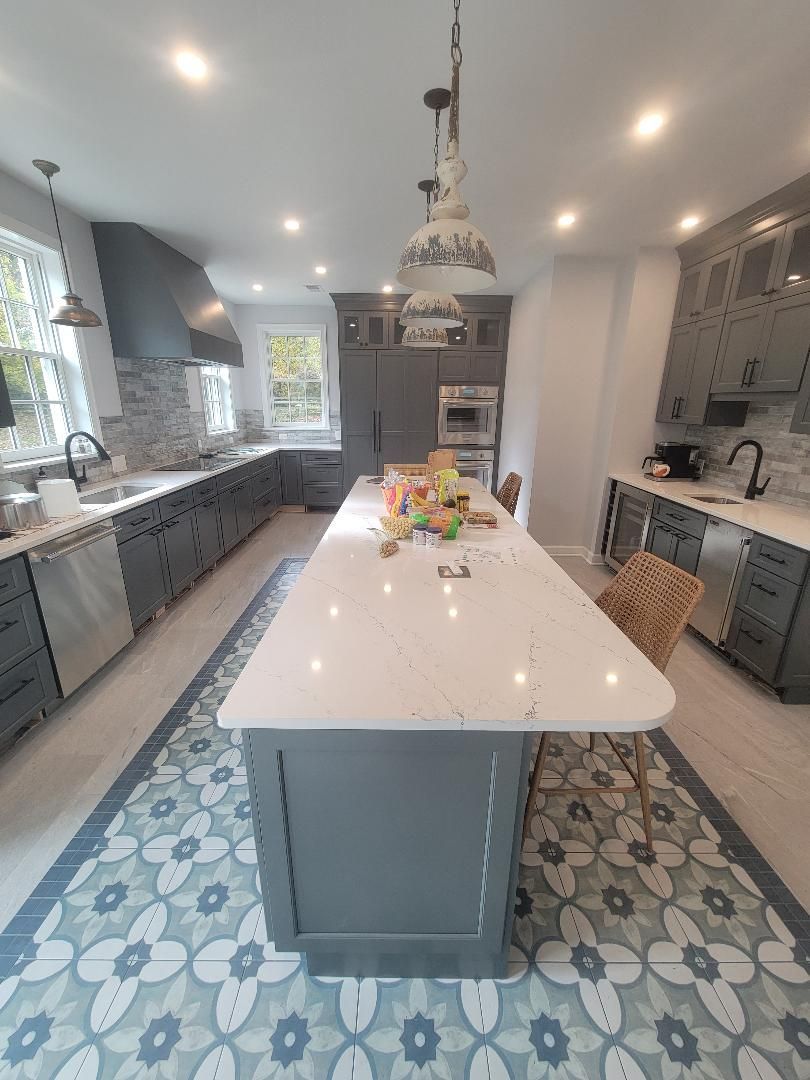 Two men are working on a kitchen in a house