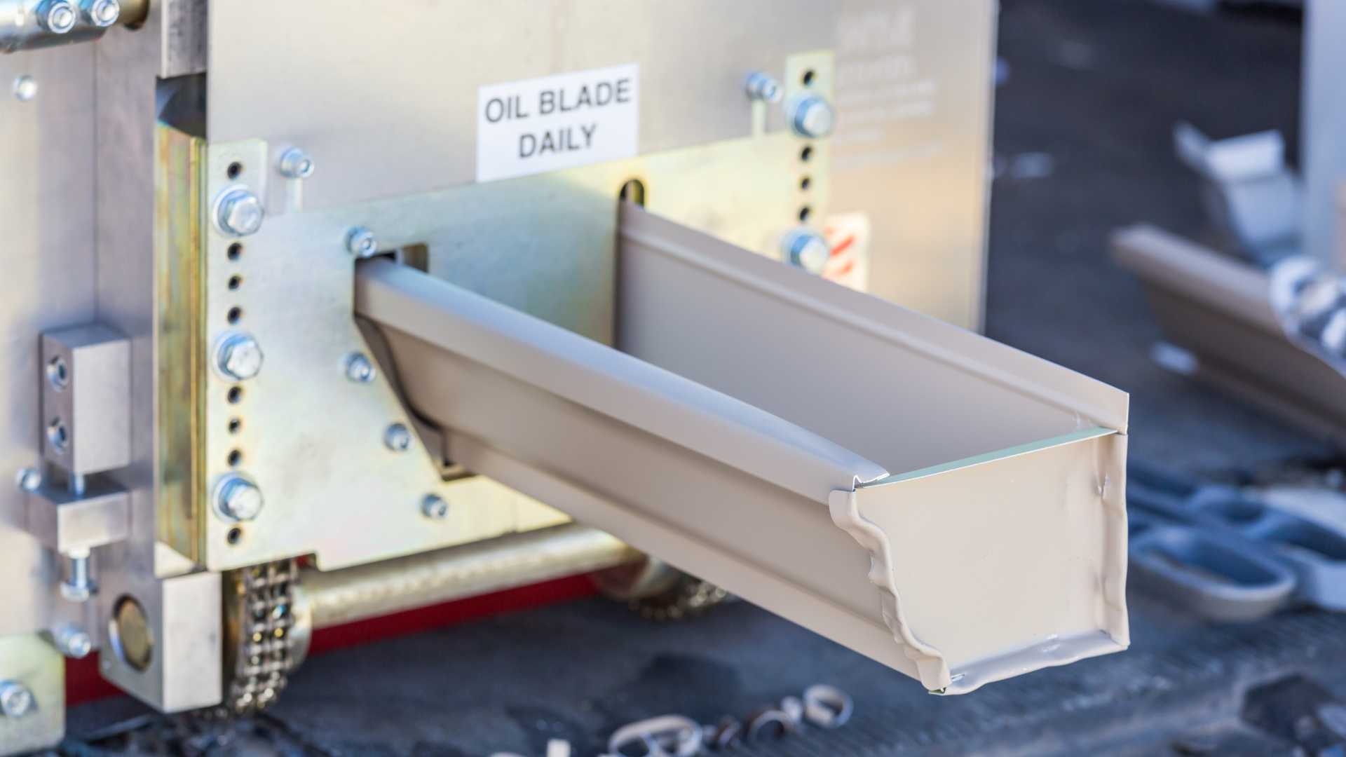 Metal chute labeled 