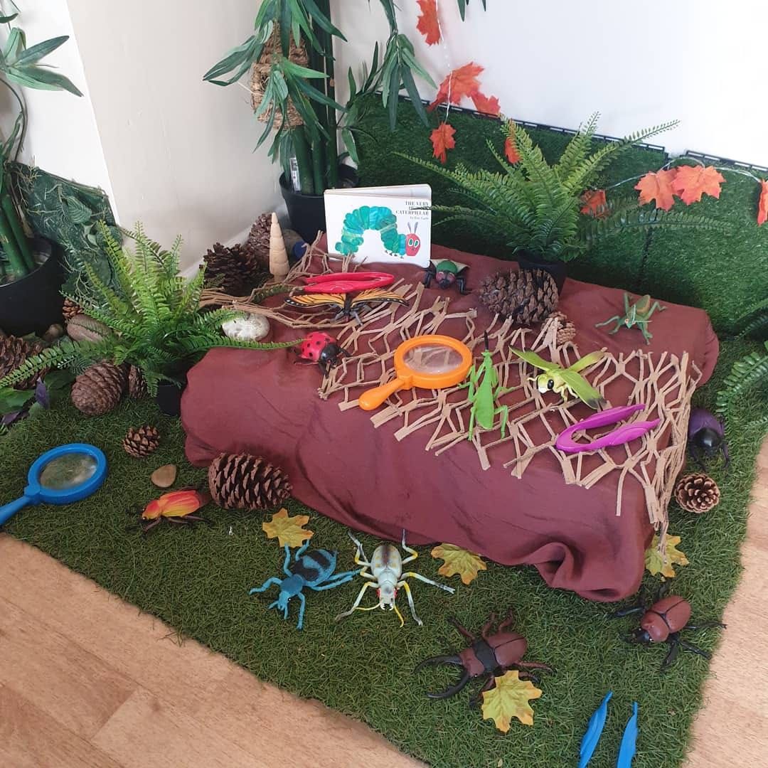 A table with a picture of the very hungry caterpillar on it