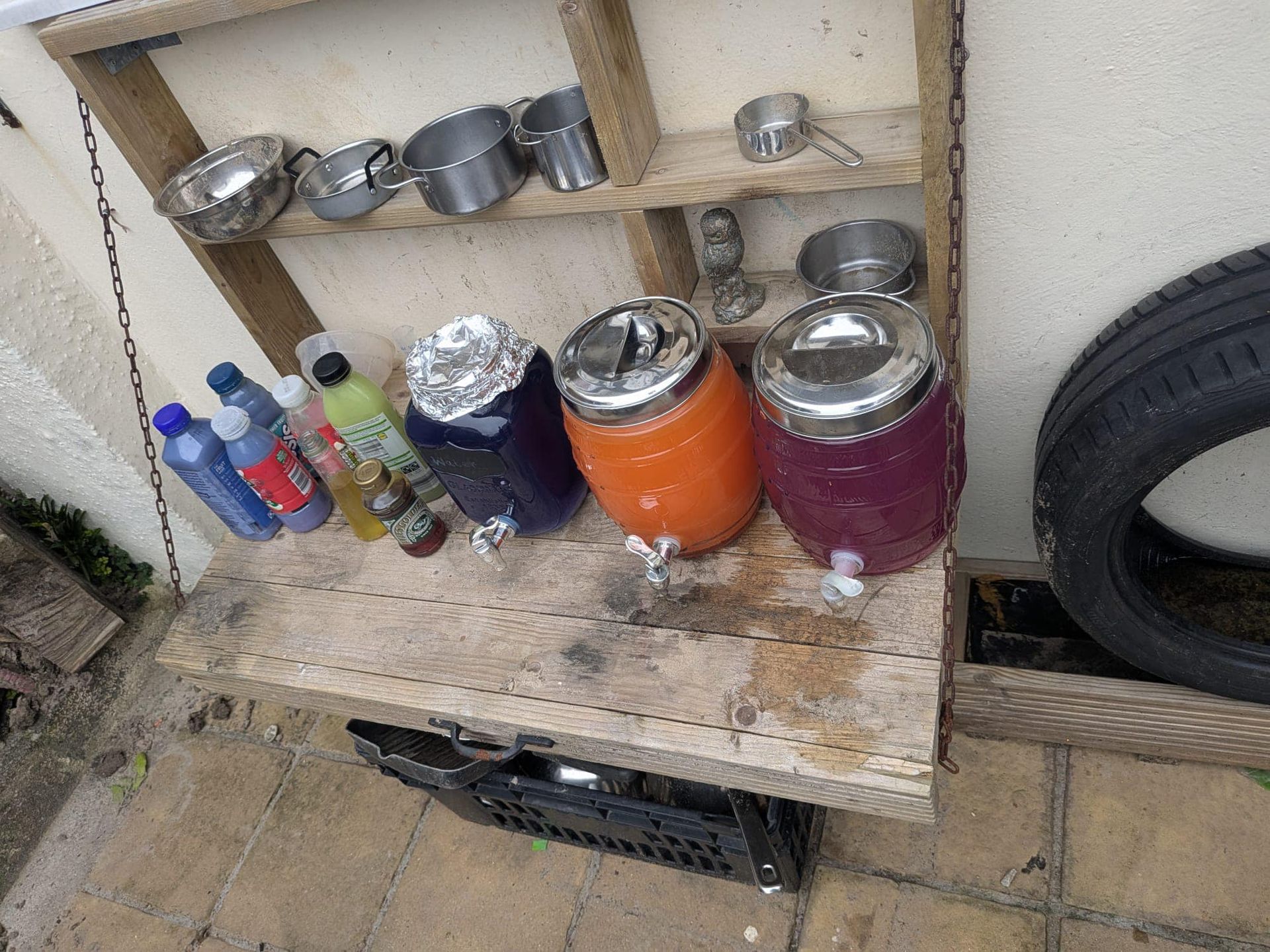 A shelf with a bunch of bottles and jars on it