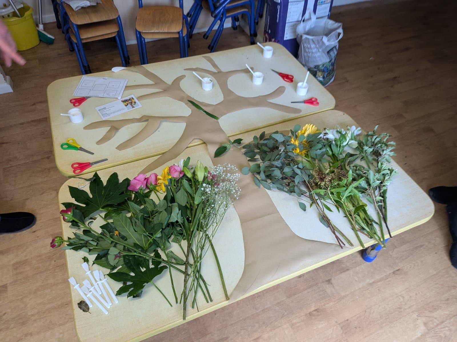A table with flowers and leaves on it
