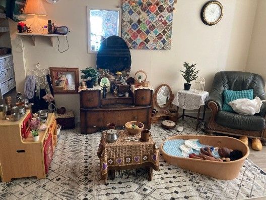 A living room filled with furniture and a coffin.