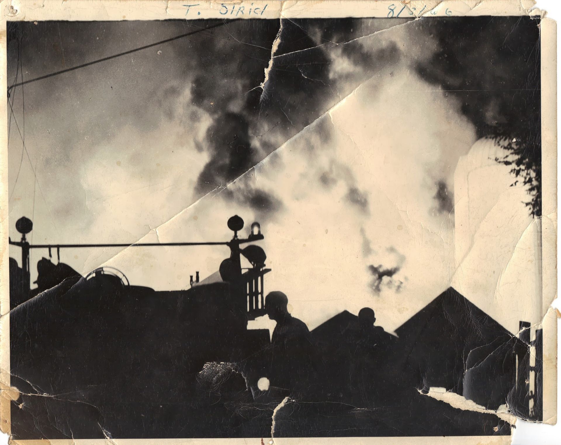 A black and white photo of a smoke filled sky