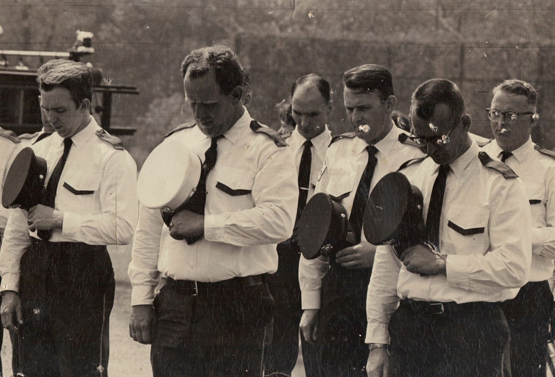 A black and white photo of a group of men in uniform