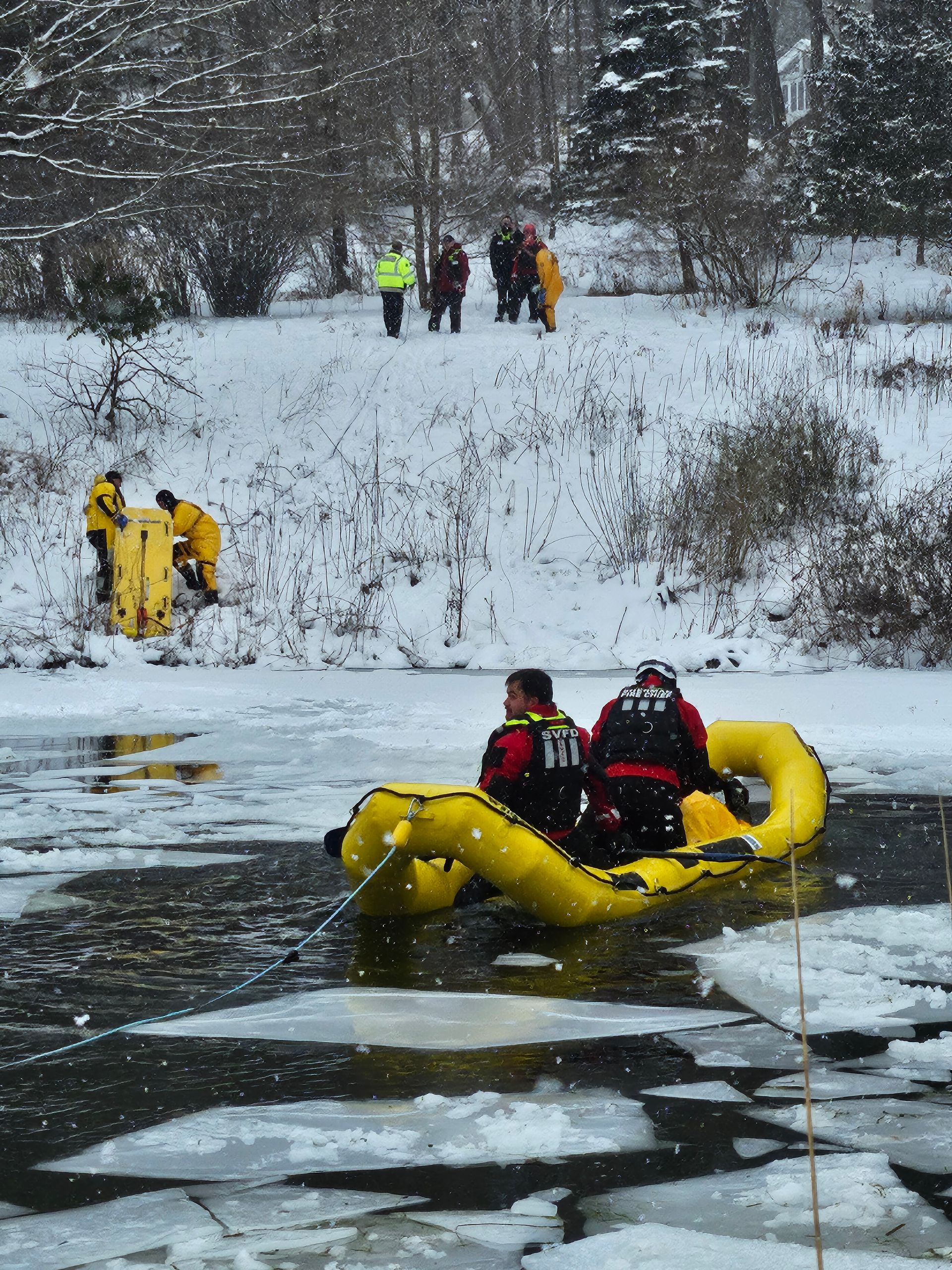 A man in a yellow raft with the number 912 on his back
