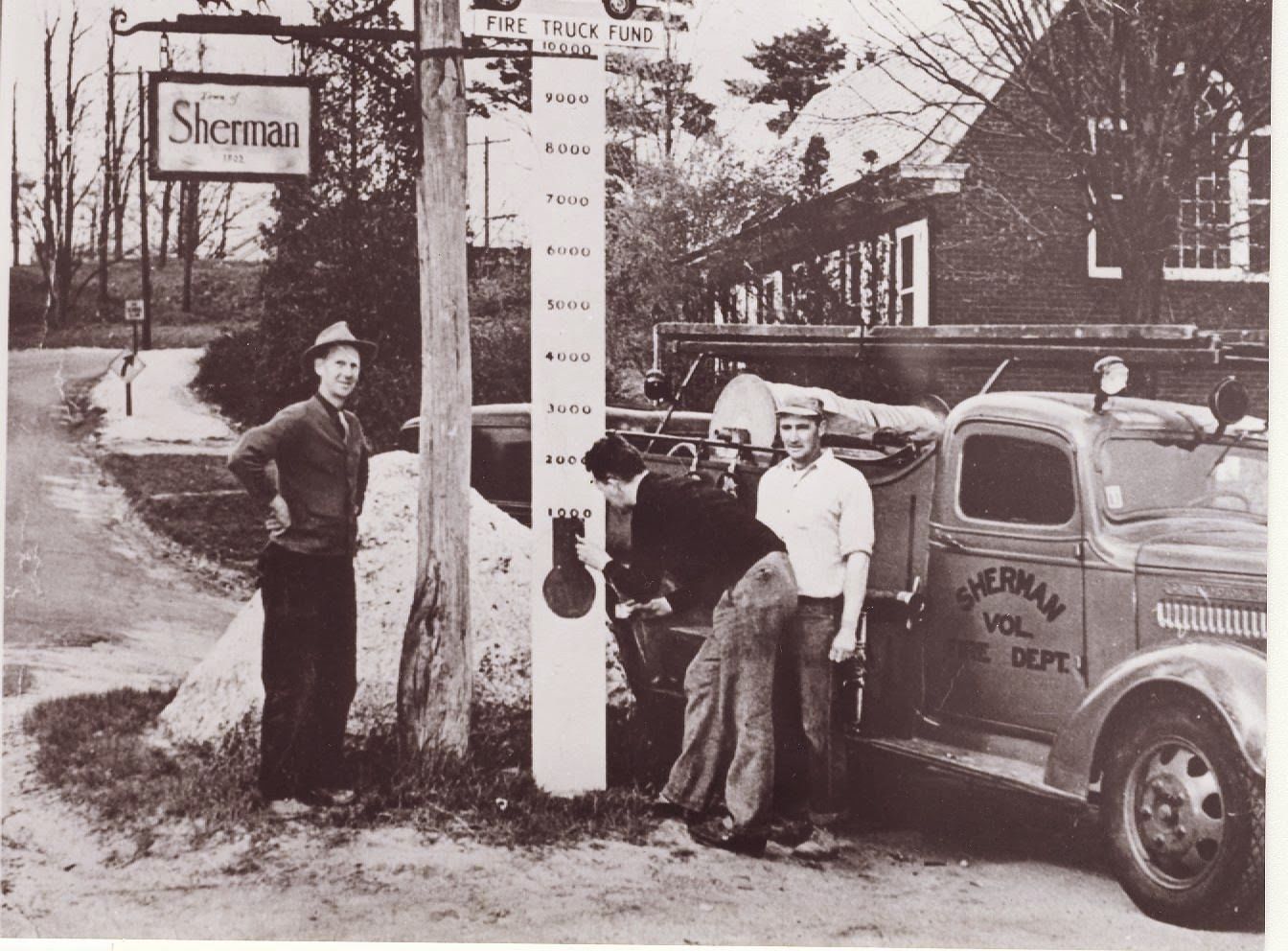 A black and white photo of a sign that says sherman