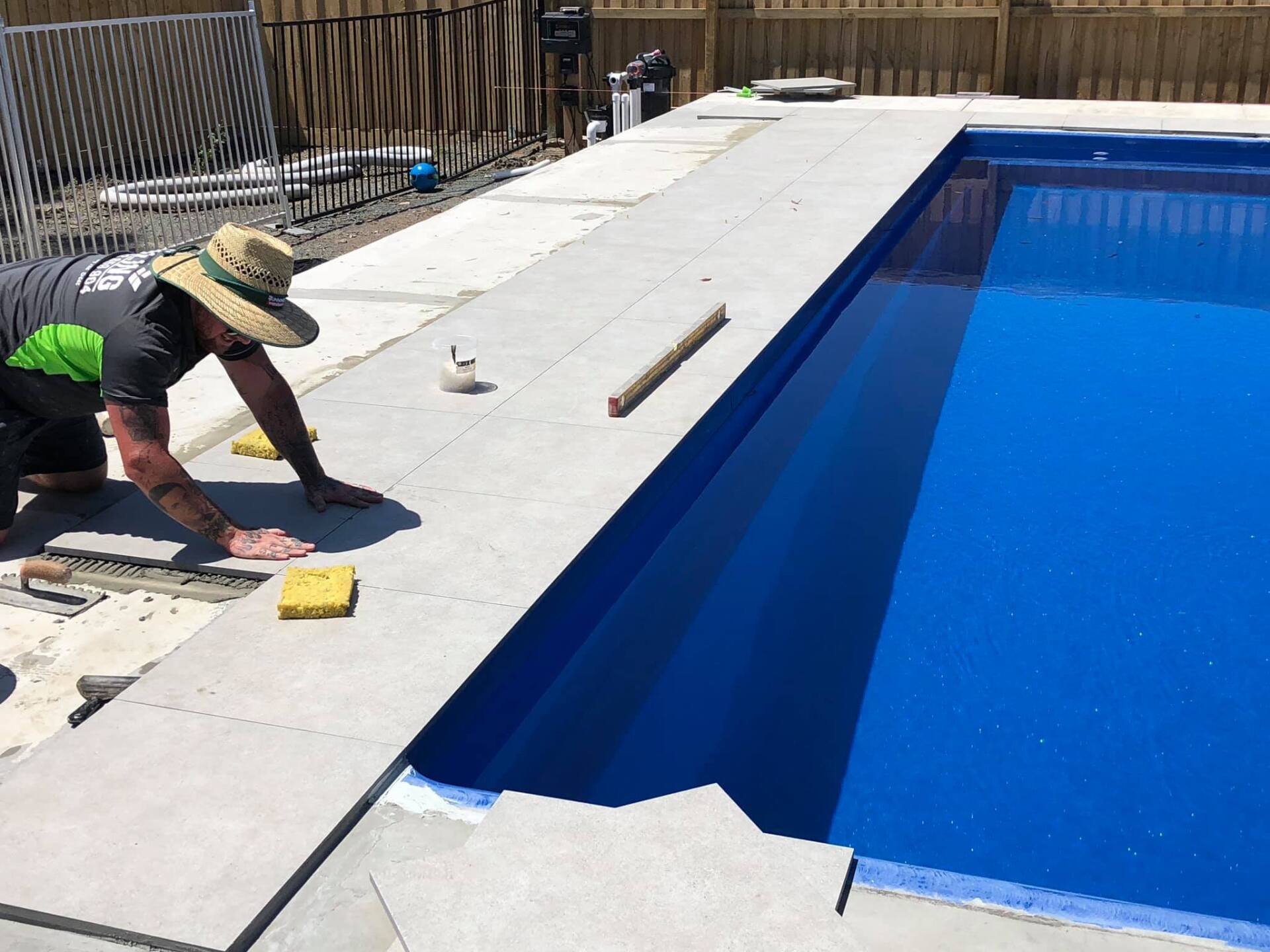 Man Working on Pool Surround Installation — Medowie, NSW — Coastcrete