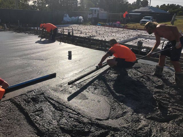 Workers Applying Concrete — Medowie, NSW — Coastcrete