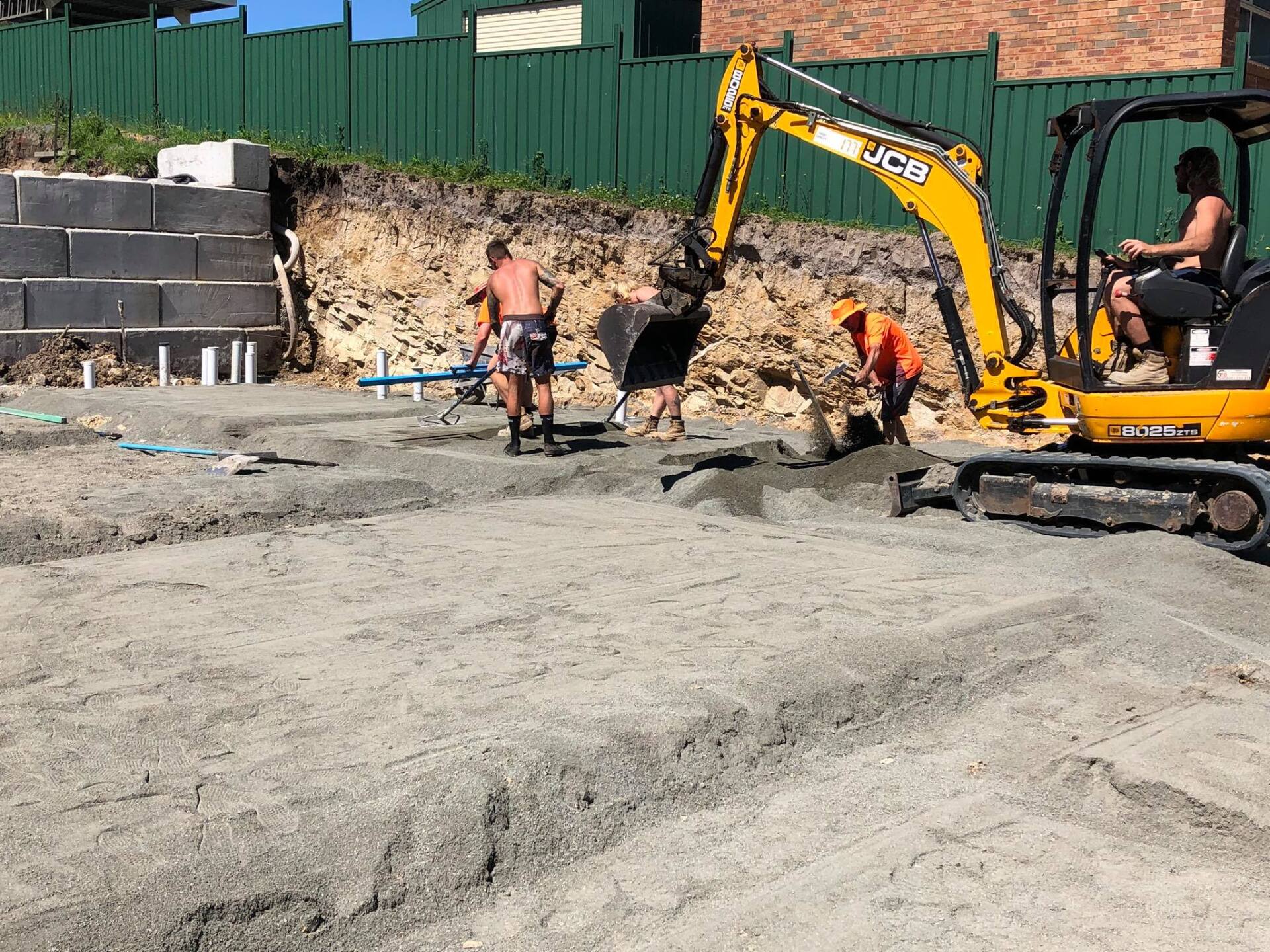 Two Workers and an Excavator — Medowie, NSW — Coastcrete