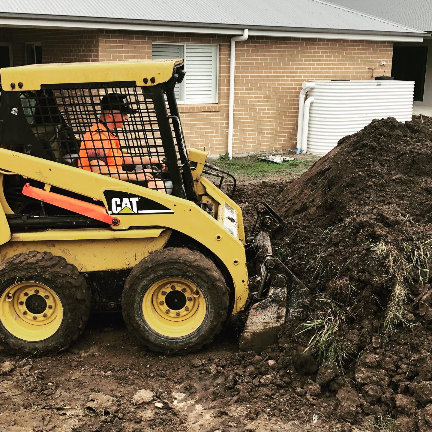 Man Operating a Crawler Loader — Medowie, NSW — Coastcrete