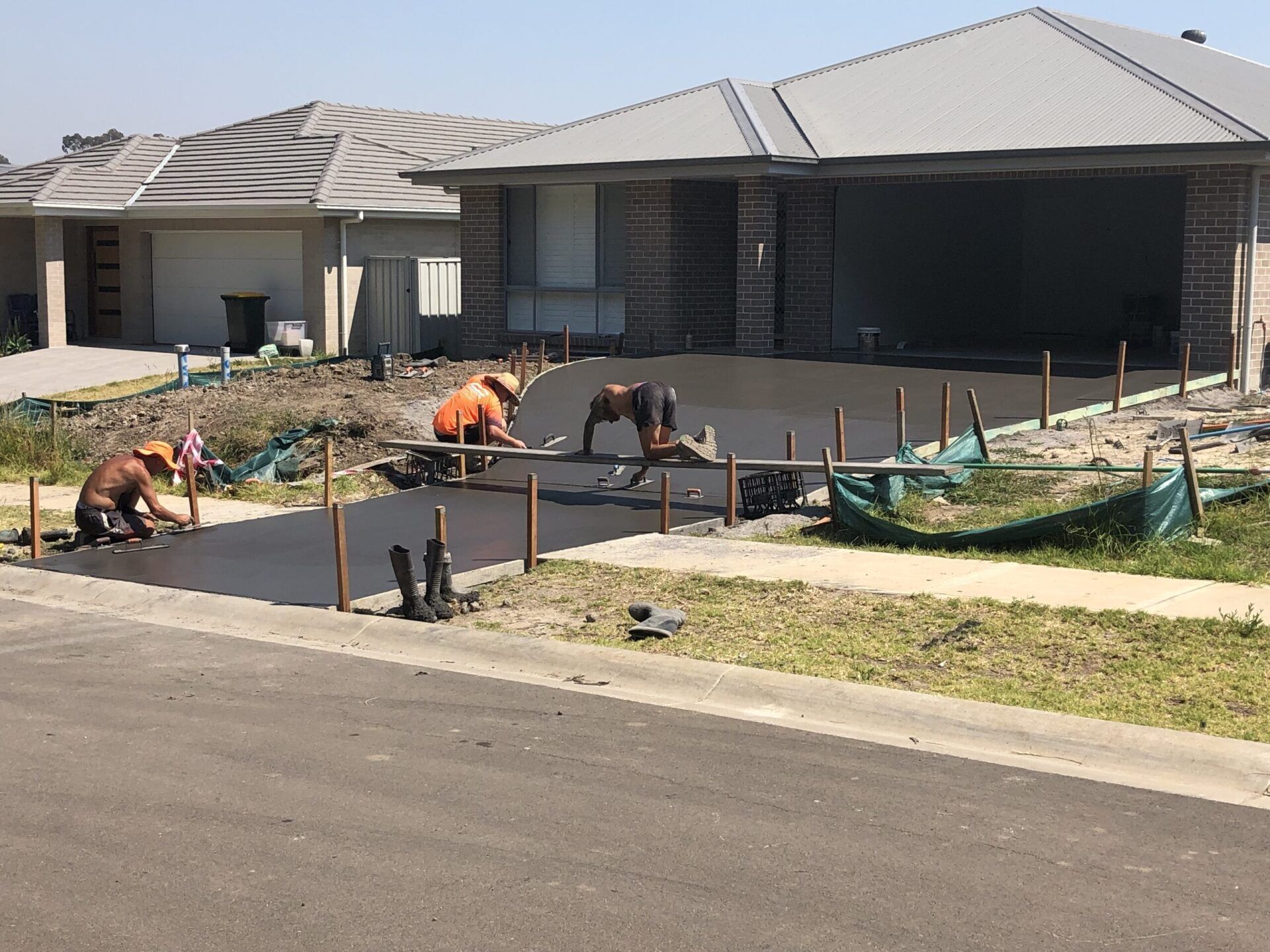 Construction Workers Working on the Driveway — Medowie, NSW — Coastcrete