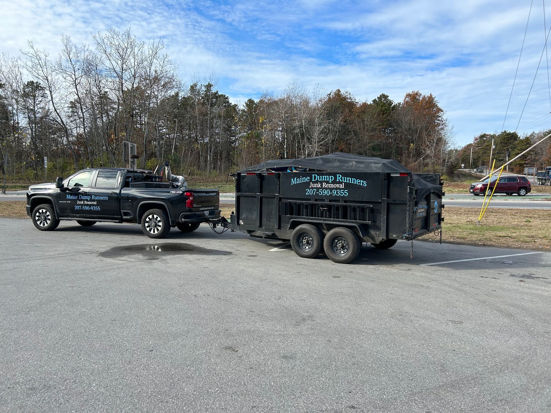 Two trucks are parked next to each other in a parking lot.