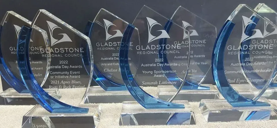 A group of trophies with the word gladstone on them