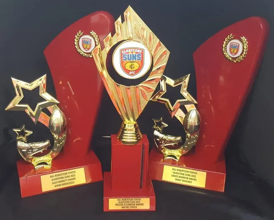 Three trophies with the word suns on them