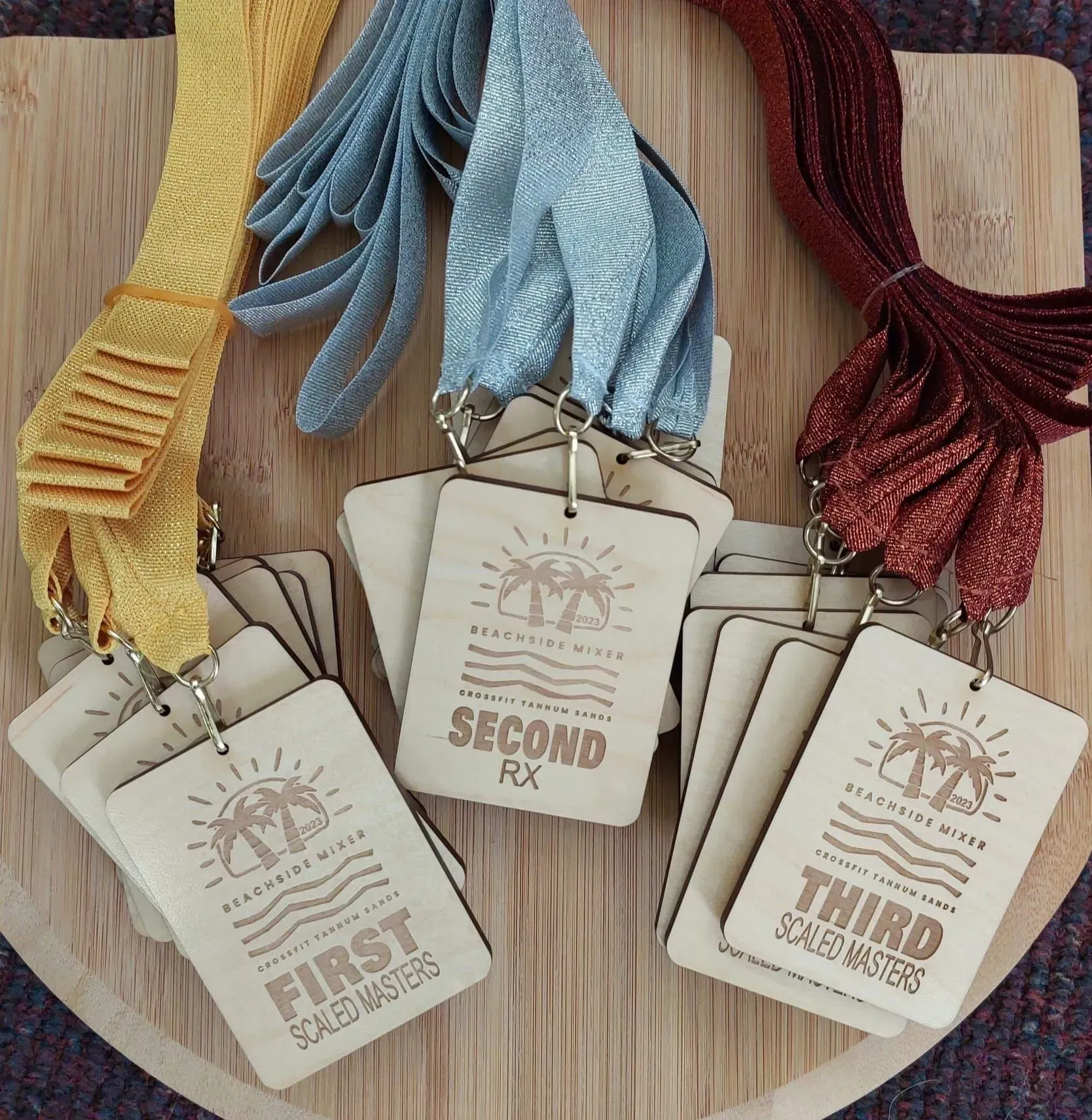 A wooden plaque that says first second and third on it