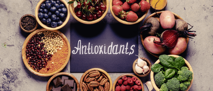 A selection of colourful fruits and vegetables rich in antioxidants and fibre, essential for supporting natural detox.