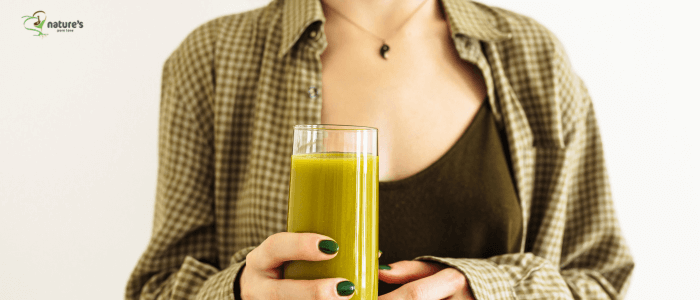 A healthy woman holding a cup of smoothie