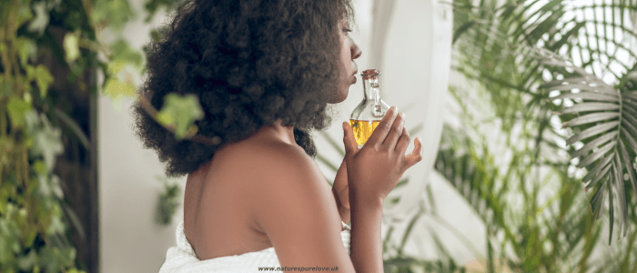 A woman using Essential oils after bath
