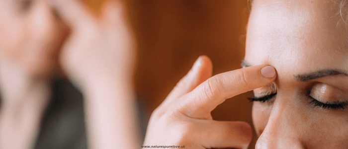 A woman practicing Aromatherapy and Tapping Technique
