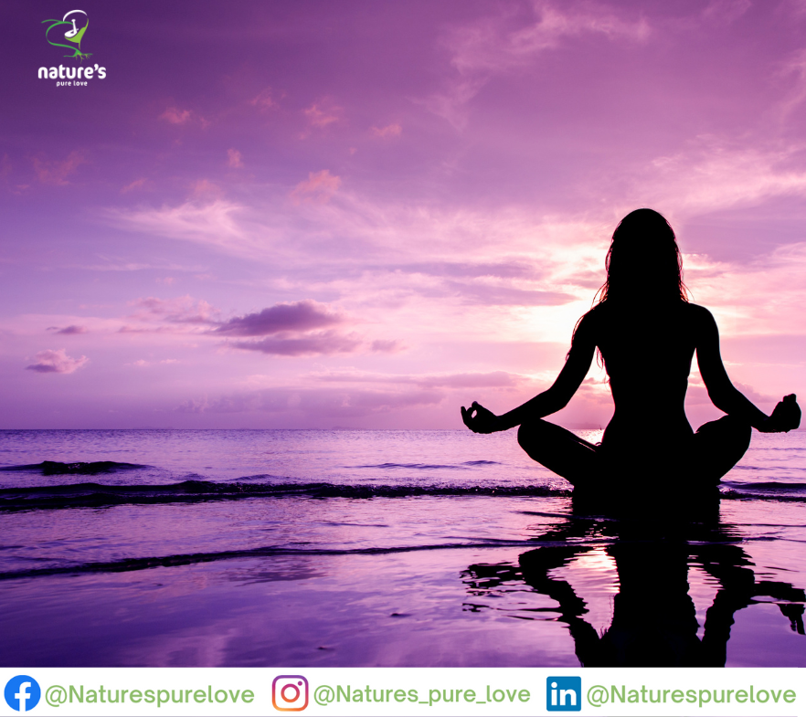 A lady meditating by the beach