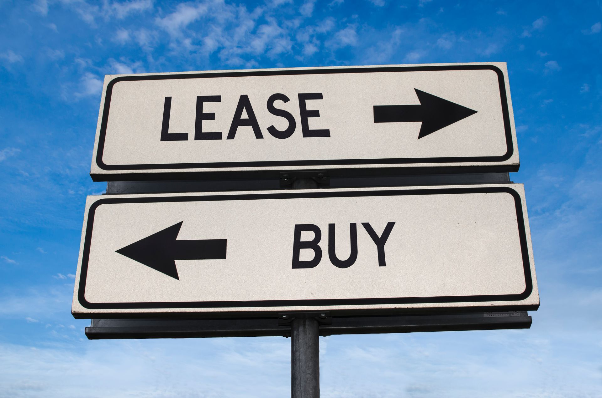 a sign that says lease and buy on it