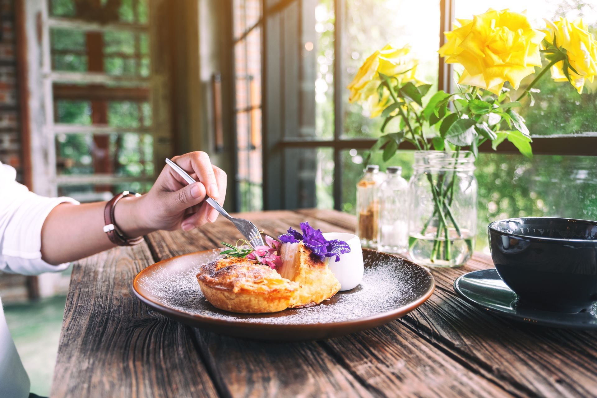 dessert pastry in cafe counter with edible floral