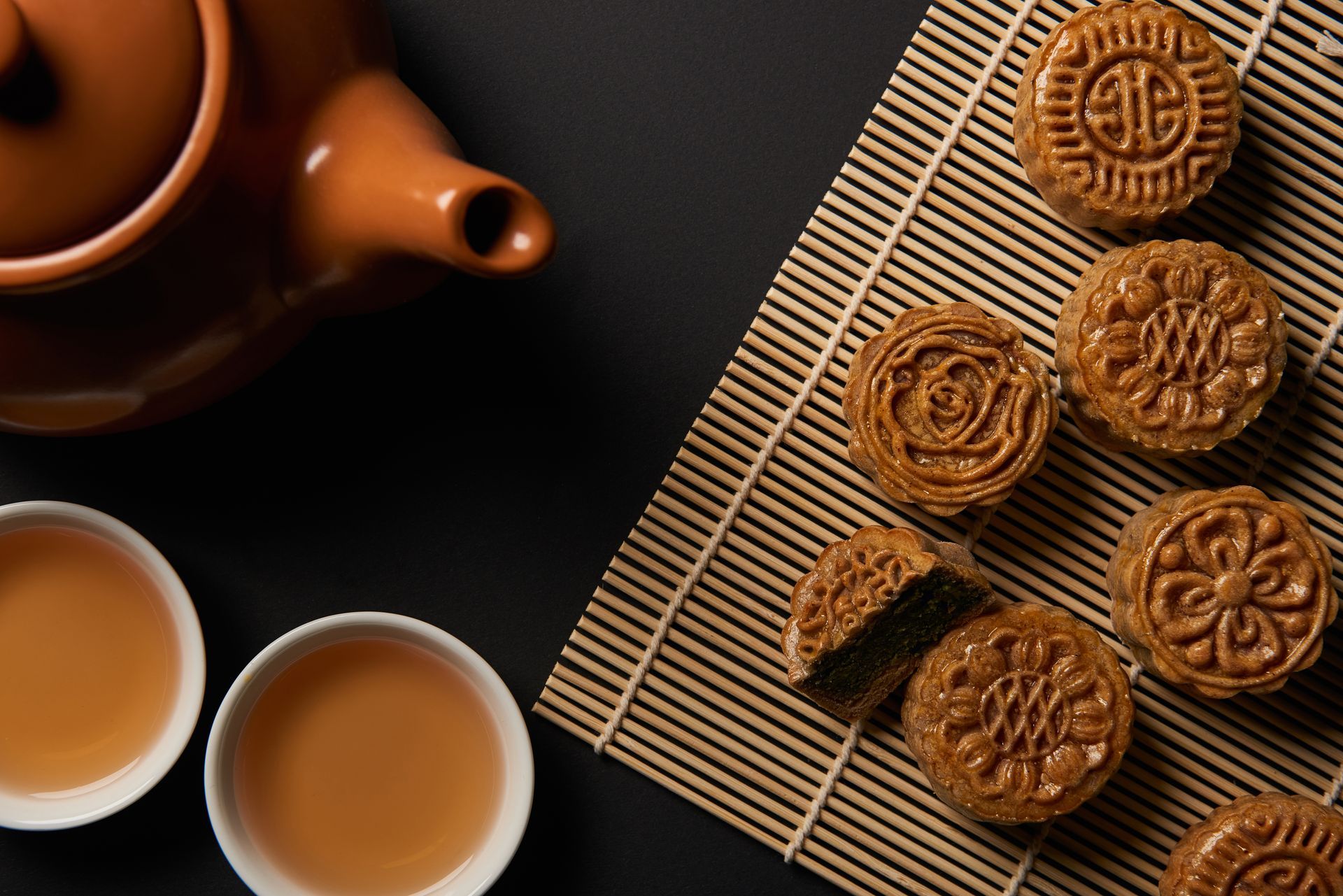 ZBS restaurant marketing holidays Mid-Autumn festival mooncakes with tea on black table