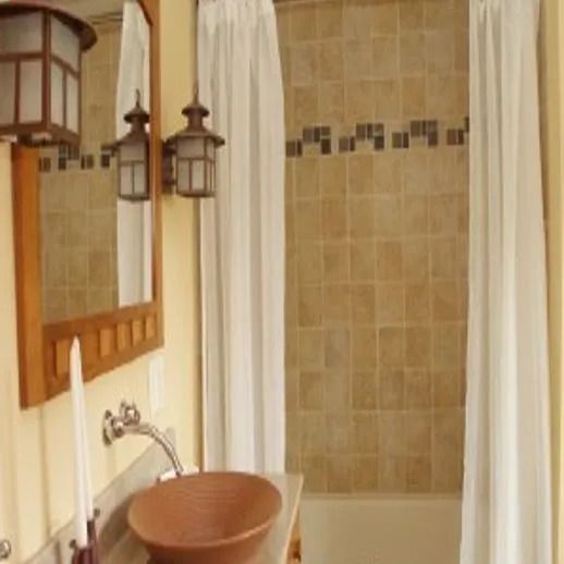 A bathroom with a sink a mirror and a shower curtain