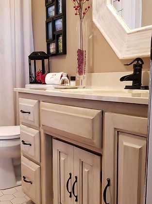 A bathroom with a sink , toilet and mirror