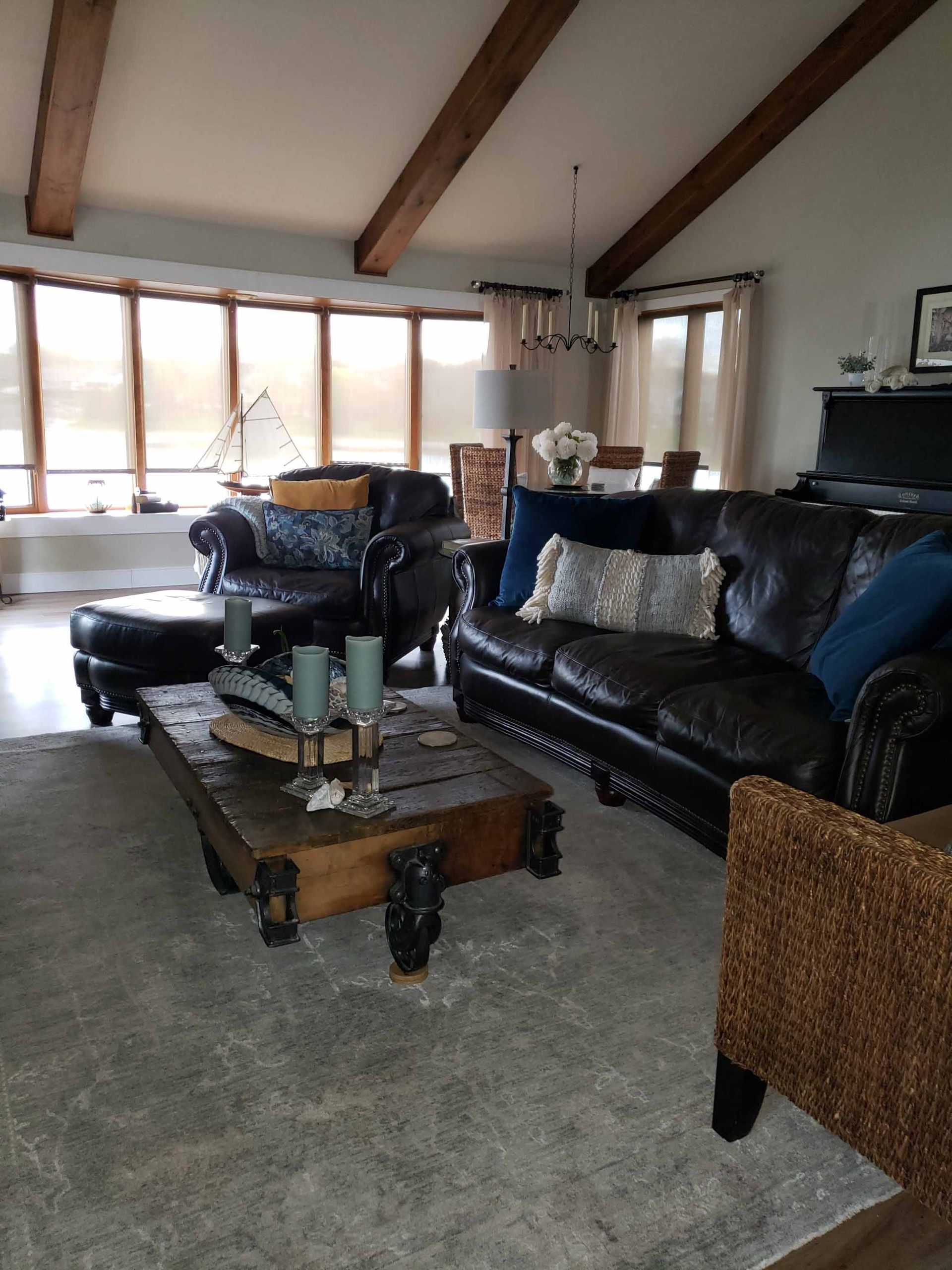 A living room with a couch a chair and a coffee table