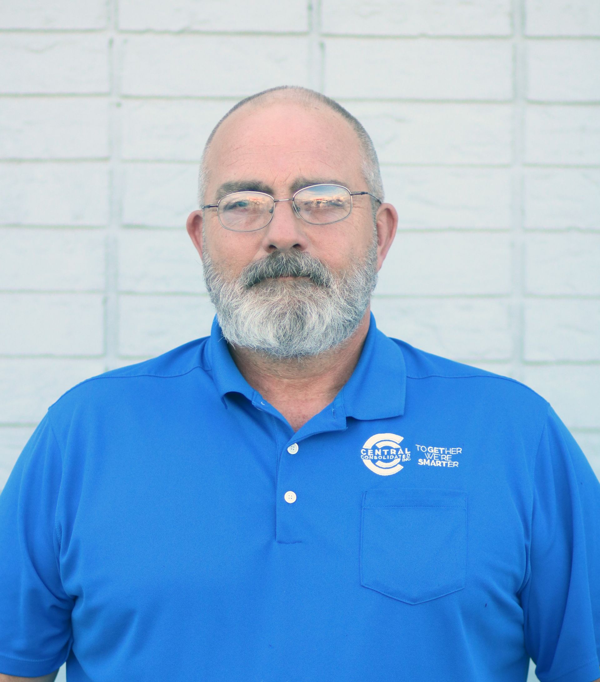 A man with glasses and a beard wears a blue shirt that says southern states
