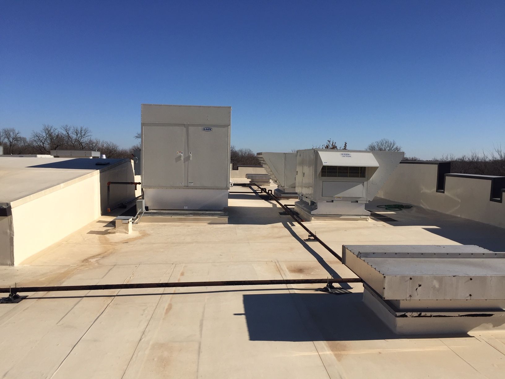 A white roof with a blue sky in the background