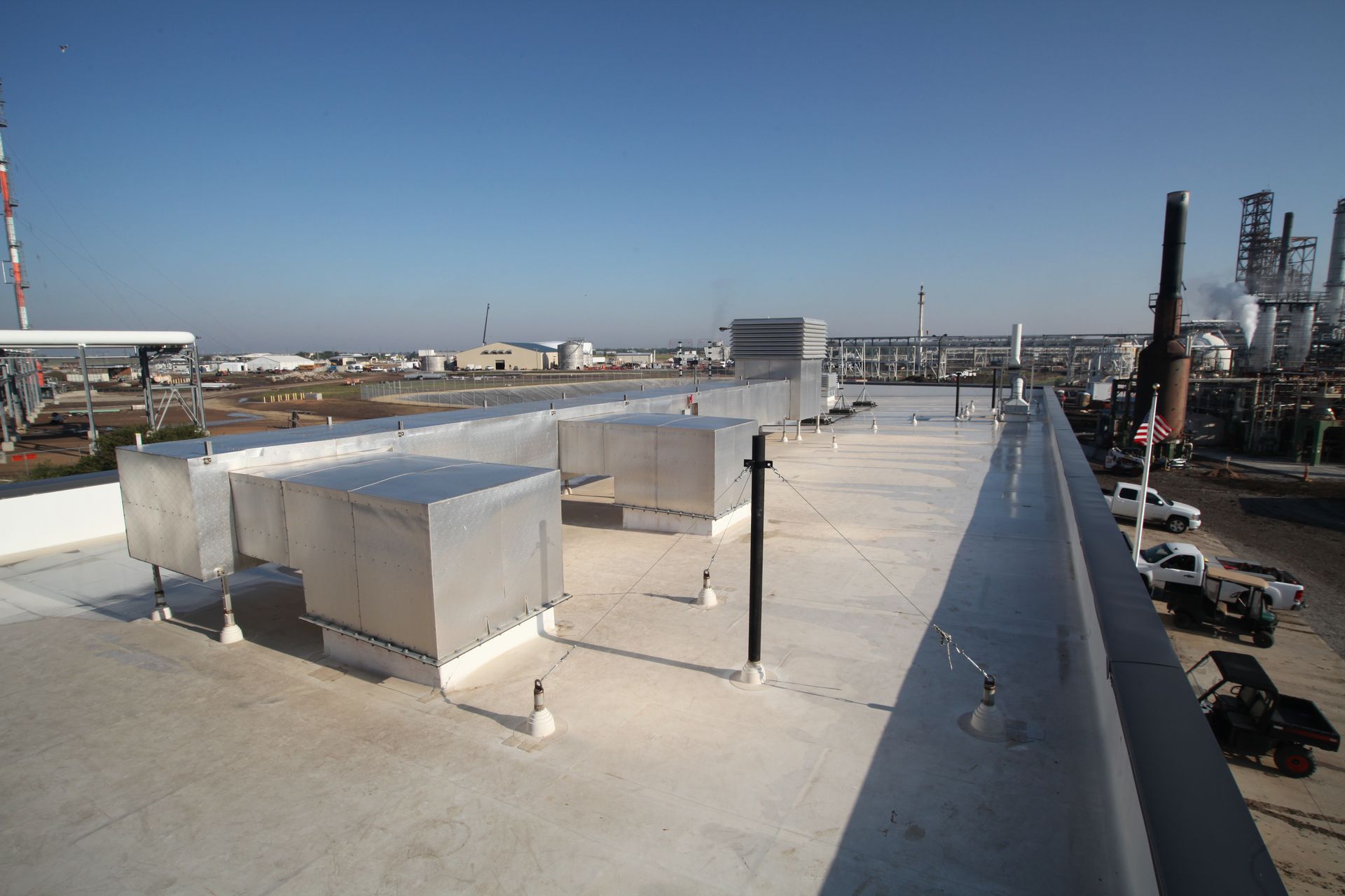 The roof of a building with a lot of pipes on it