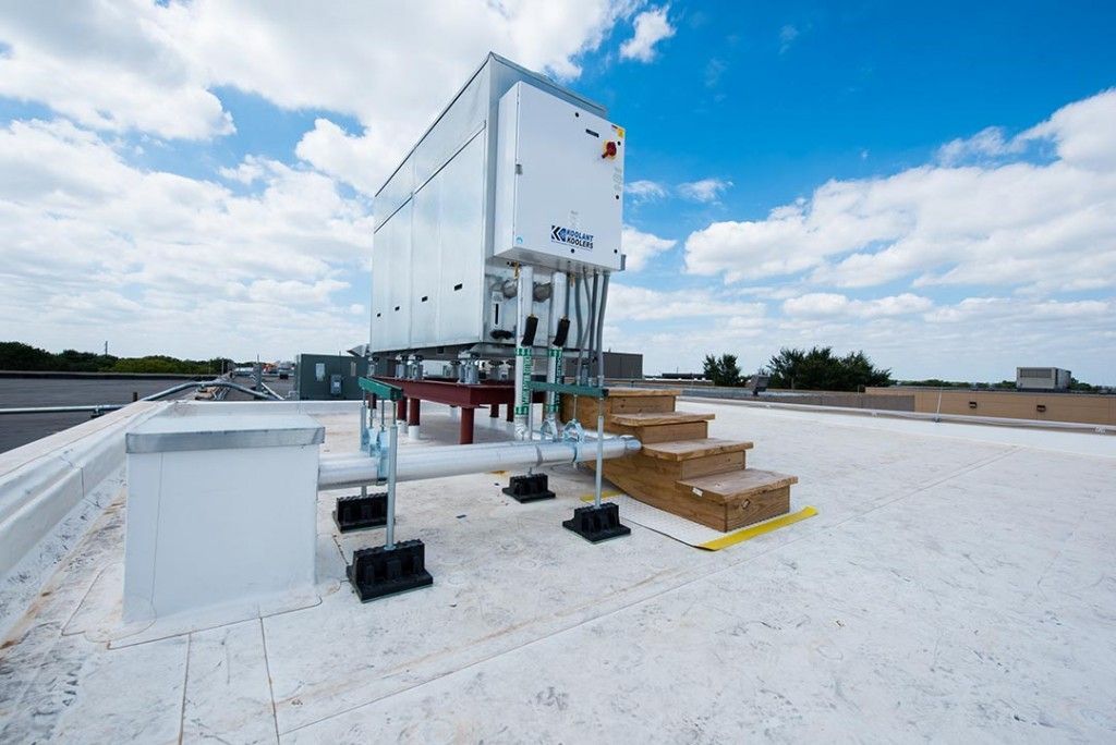 A large white box is sitting on top of a white roof.