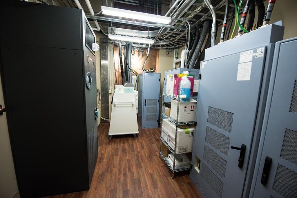 A room with a lot of cabinets and boxes on the floor.