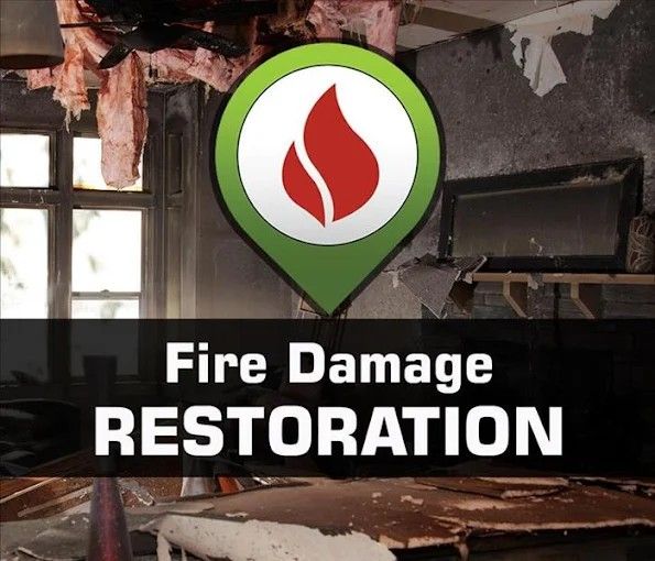 Fire-damaged room with a logo indicating fire damage restoration services.