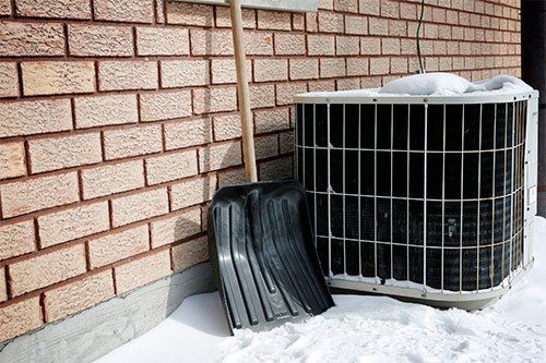Air Conditioner And Shovel In Snow