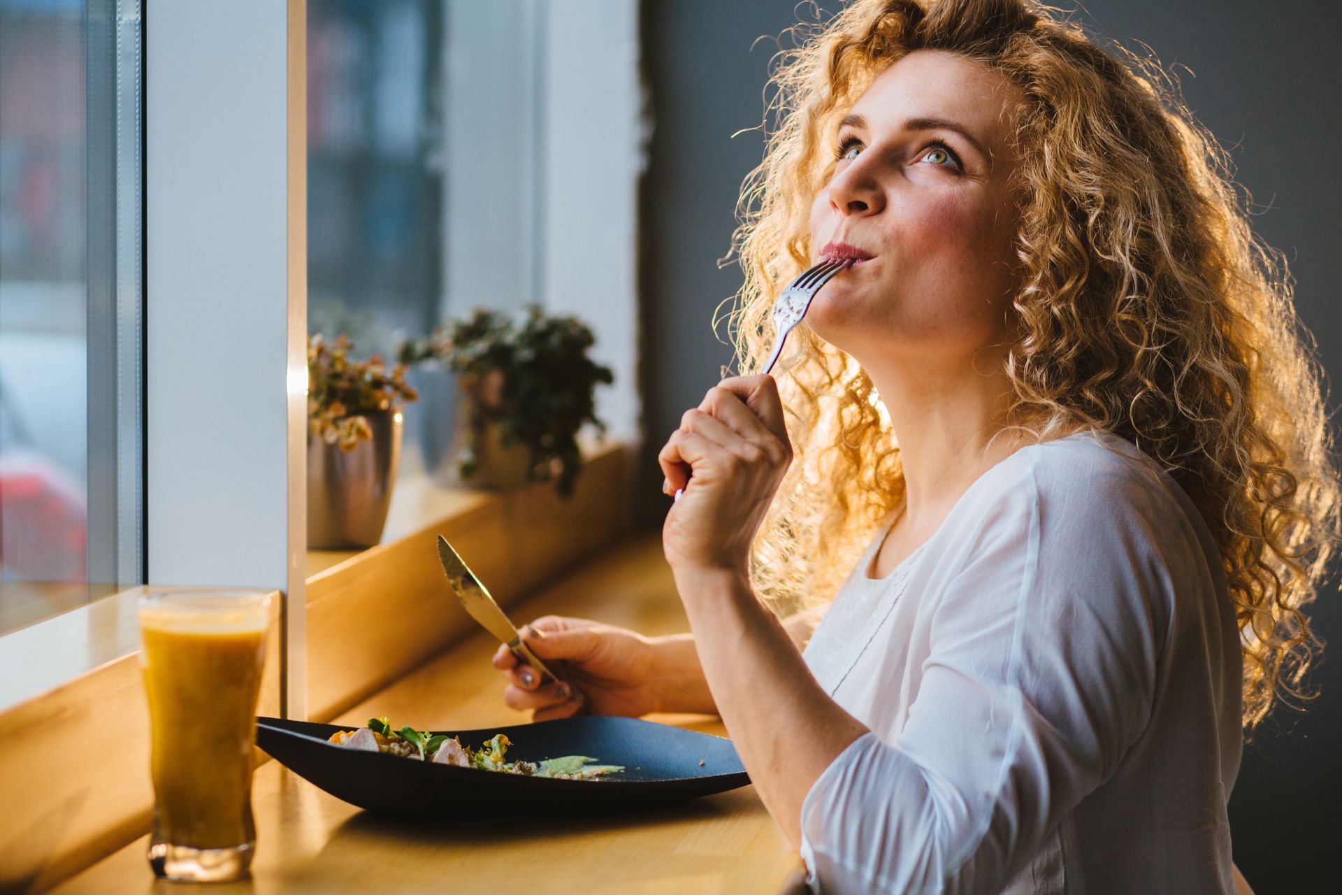 Woman eating thyroid friendly foods