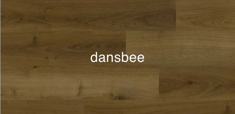 A close up of a wooden floor with the word dansbee written on it.