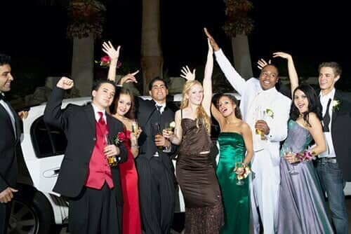 Teenage Boys and Girls Standing in Front of a Limousine — Corporate Limousine Service in Tampa, FL