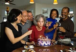 Old Woman Blowing the Candles of Her Cake — Corporate Limousine Service in Tampa, FL